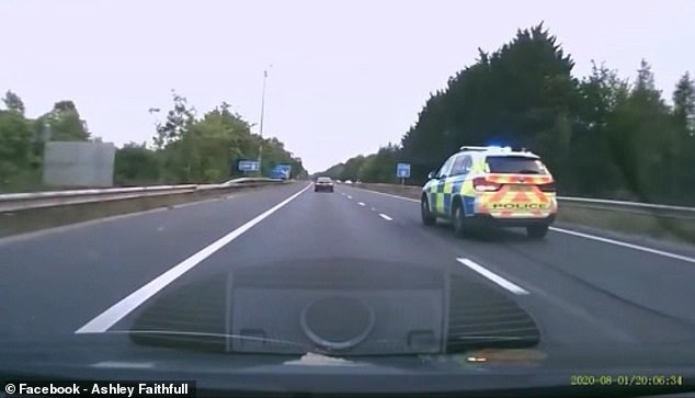 A police car with flashing lights is seen on the dashcam footage seconds later. It appears to be hot on the tails of the orange car which is speeding dangerously fast